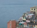 The pastel-colored tower-houses overlooking the sea